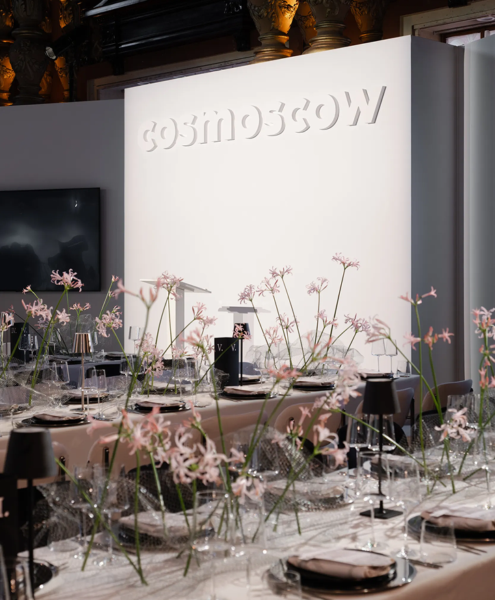 Cosmoscow installation behind the dinner tables
