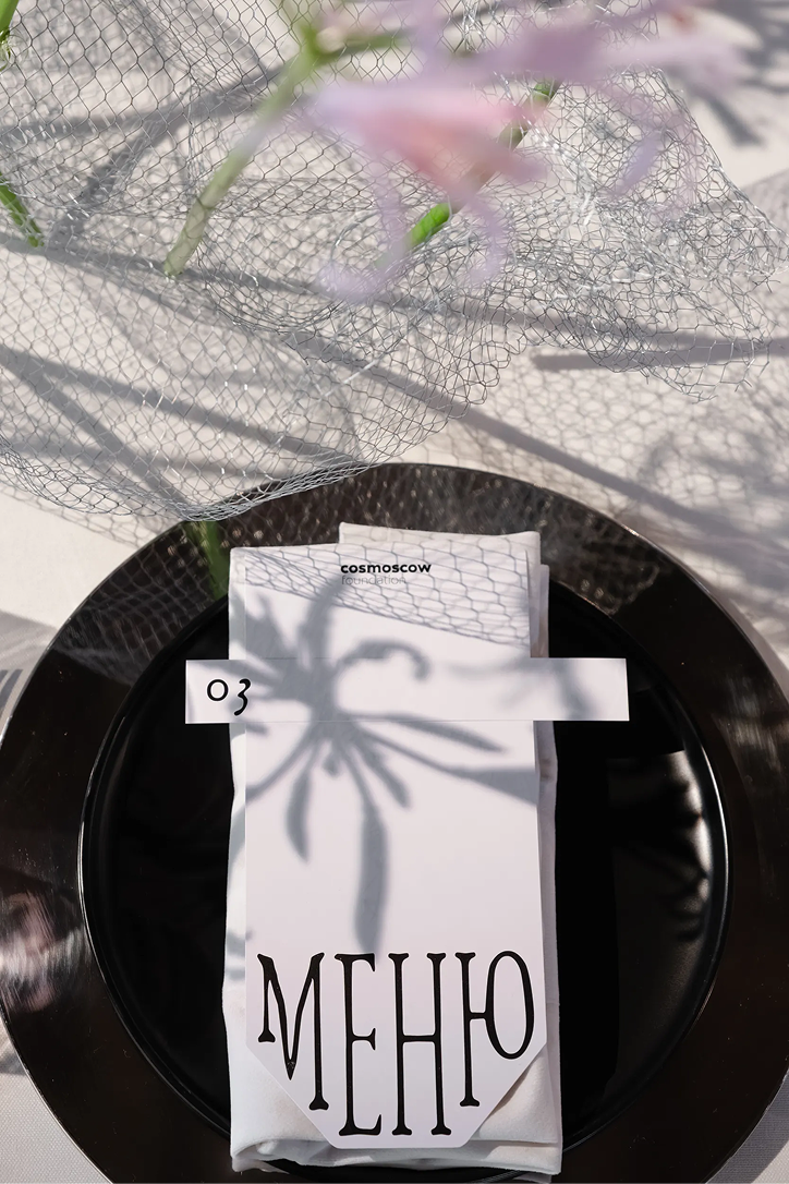 Cosmoscow menu with table number on a plate