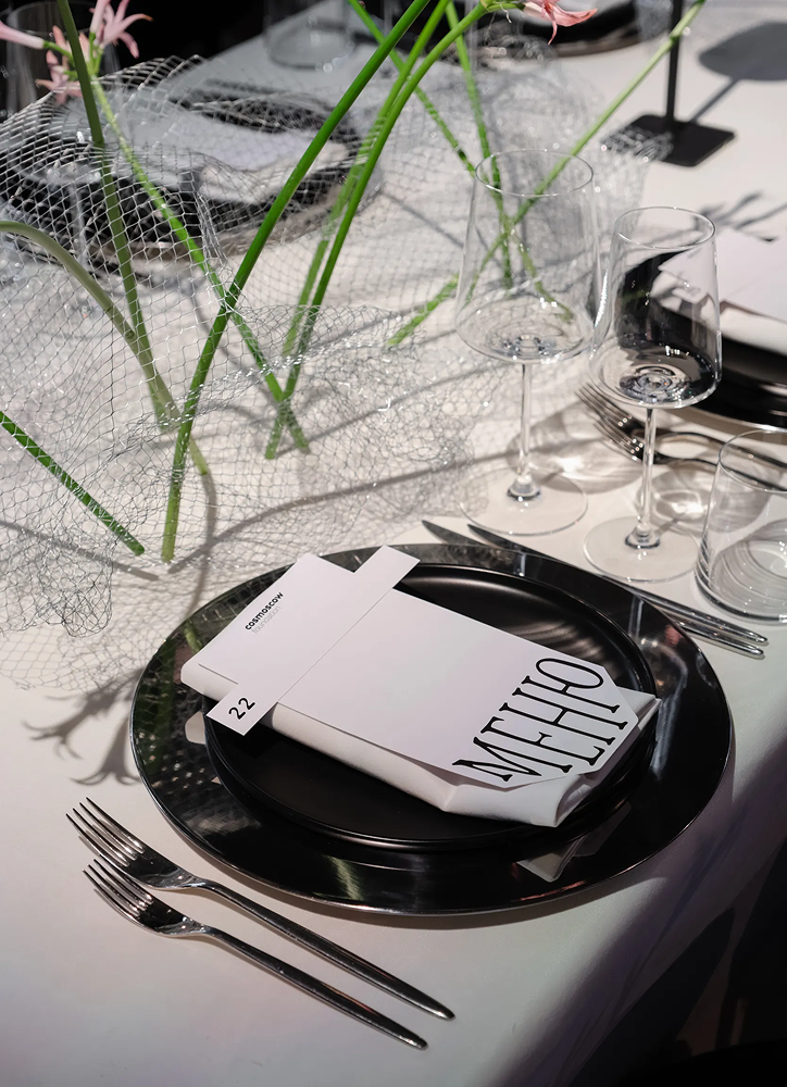 Cosmoscow folded menu on a place setting