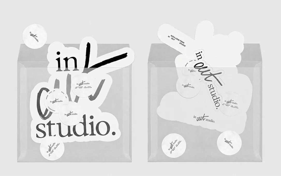 Transparent envelopes with IN–OUT Studio stickers