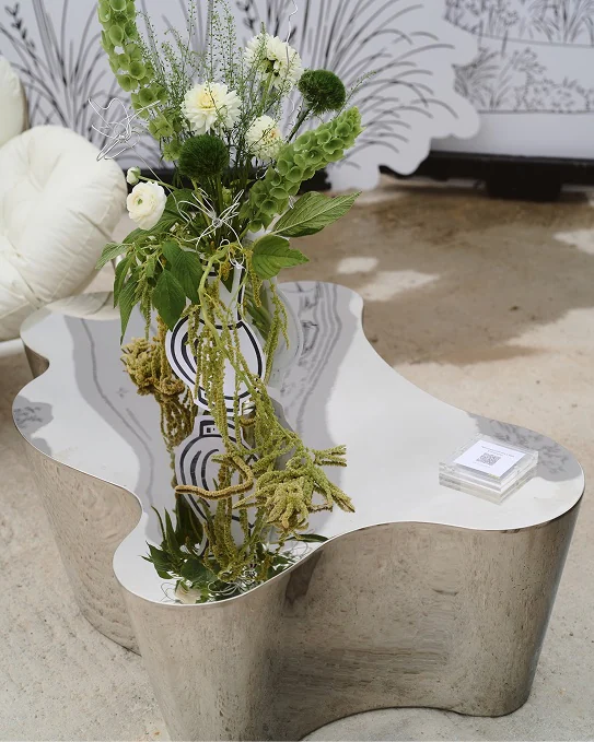 Flowers on a mirrored table