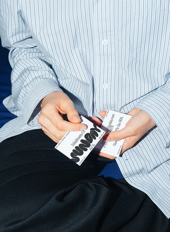 Business cards in hands